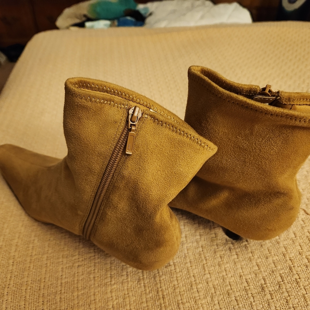 Never worn tan ankle boot with 2 inch heels.  Impo stretch brand, size 10